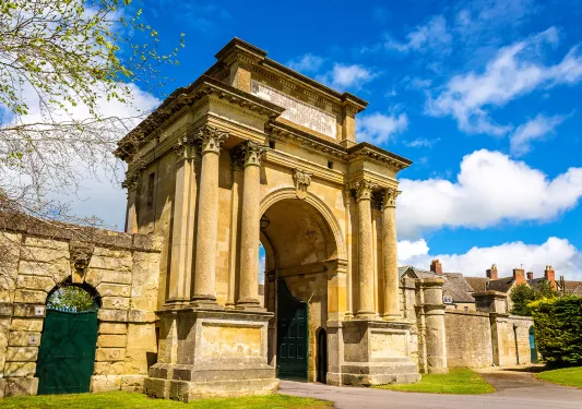 Rustic, yellow arc with large pillars connected to it