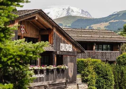Outdoor view of a wooden building with large open balconies