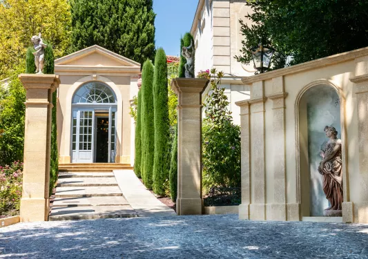 Stone walkways with pillars with statues on top