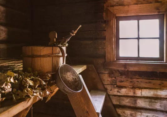 Wooden bucket in a wood cabin