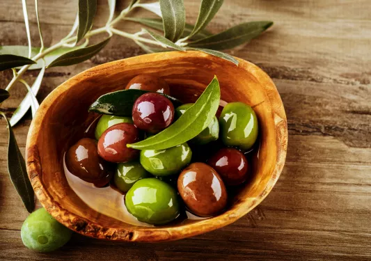 wooden bowl of olives