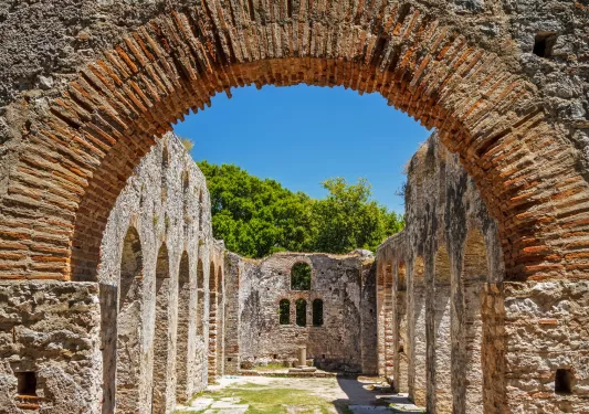 Stone archway looking towards other stone structures