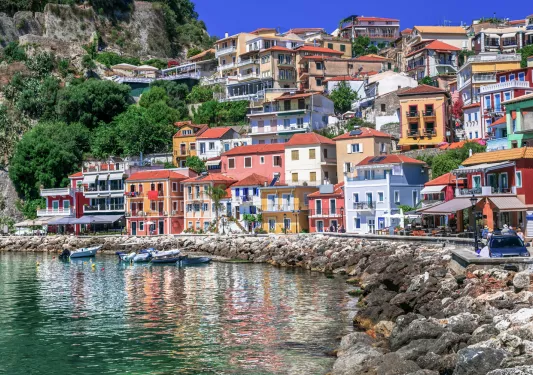 Colorful houses sitting on a rocky shore