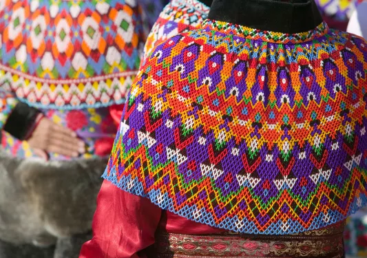 person wearing colorful knitwear