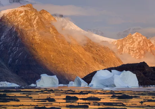 Orange mountains with icebergs