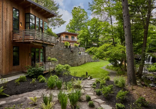 Outdoor courtyard oh building with trees and grass