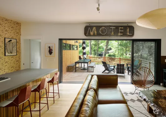 leather couch and wooden bar with large motel bar