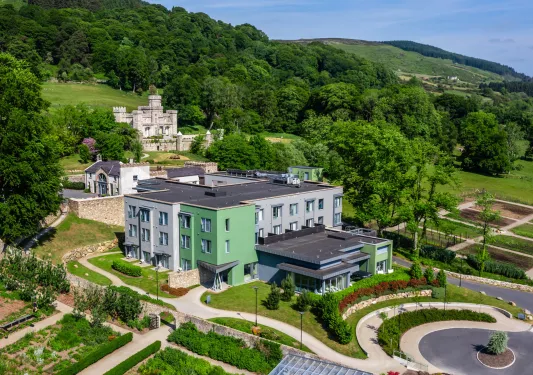 Outdoor view of blue and white building with outdoor patio