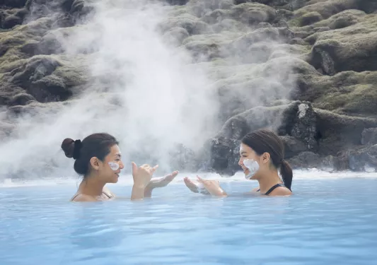 two guests floating in a hotspring