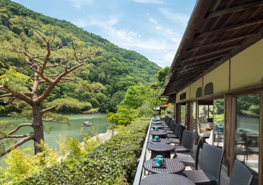 terrace with bistro tables looking out onto water