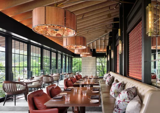 Hotel dining room with sloped wood ceilings