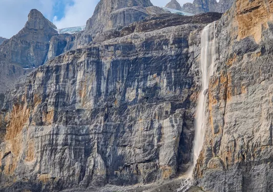 Tall canyon with a waterfall on the right