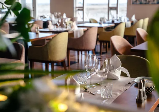 Dining room with two empty wine glasses on the table