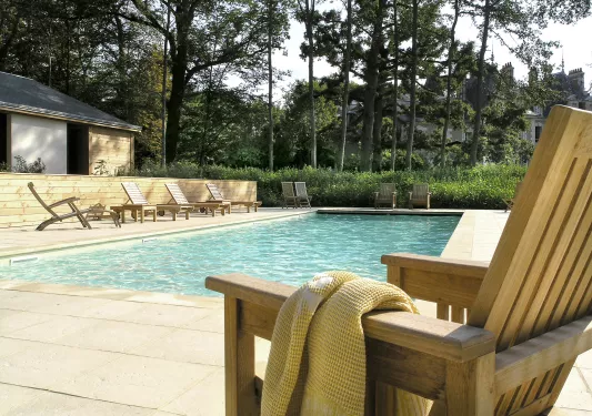 swimming pool with lounge chairs