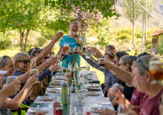 table of guests cheersing