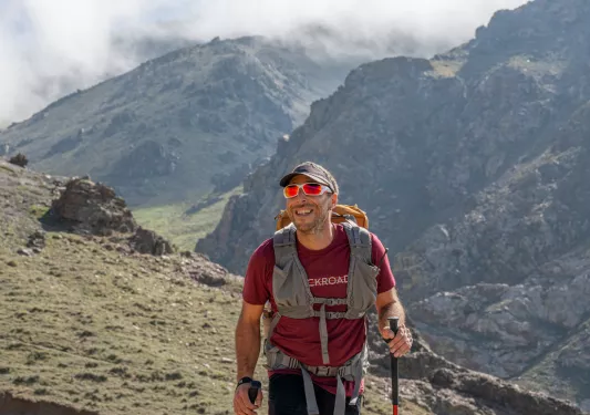 hiker walking up a mountain