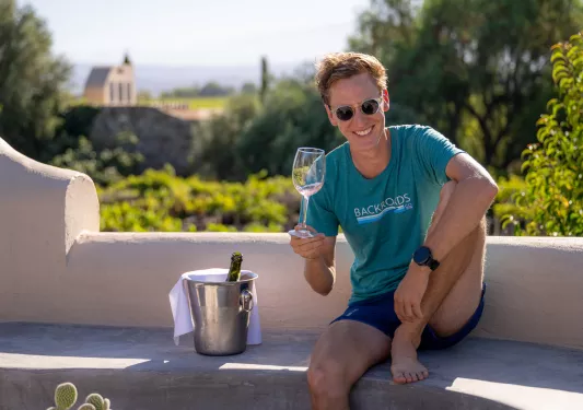 a backroads guest enjoying a glass of wine