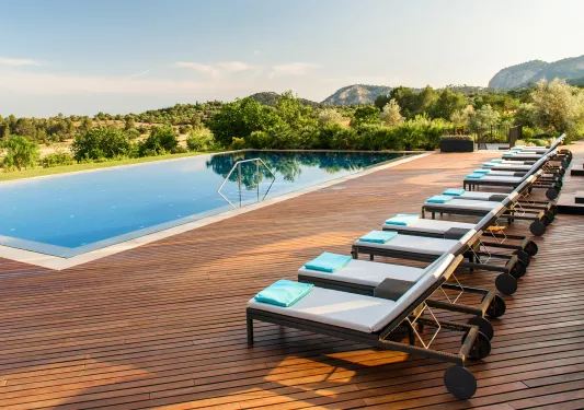 hotel pool with lounge chairs