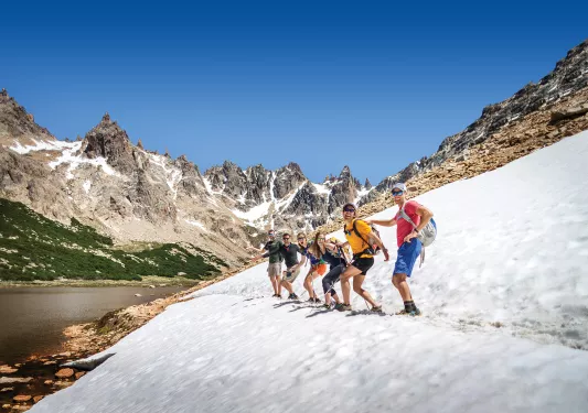 Group of hikers standing on snowy path