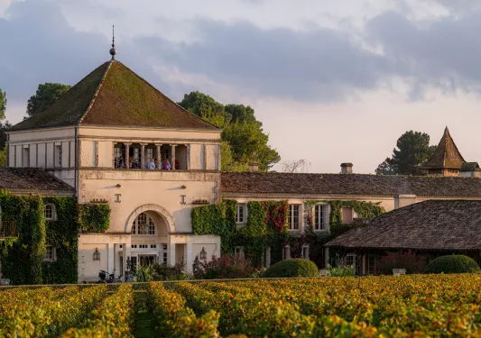 External view of rustic building with crops in the front