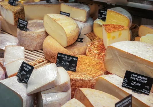 Cheeses in a display case