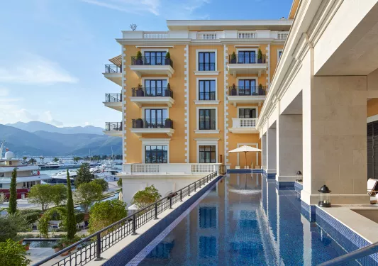 narrow swimming pool off of hotel