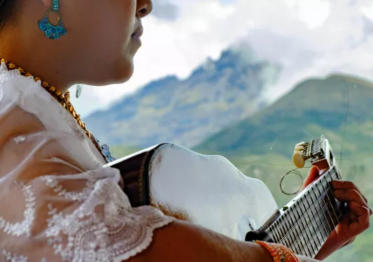 Woman playing the guitar