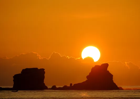 Sun rising over the water