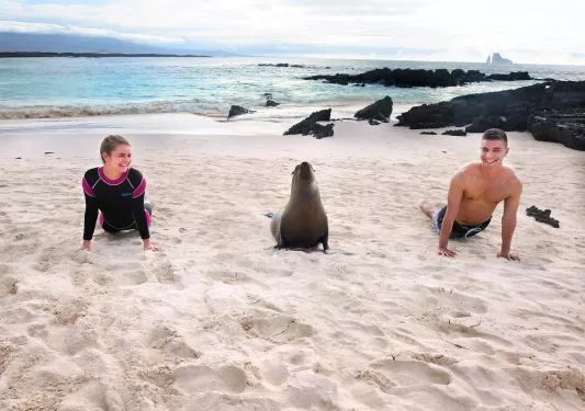 Three people in the water at the beach