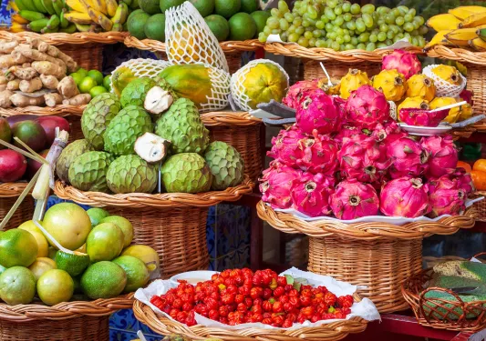Vendor stall full of fruits and vegetables