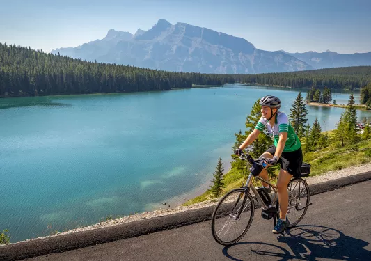 cyclist riding by a lake