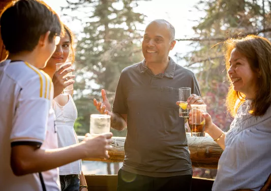 guests talk to each other while having cocktails