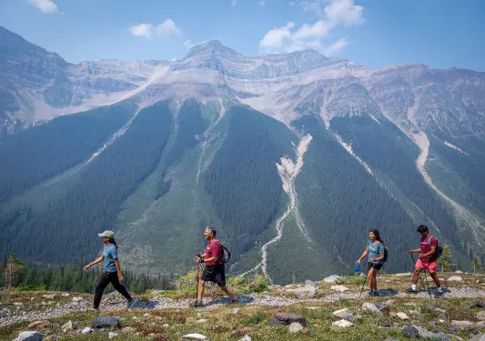 backroads guests hiking by a mountain