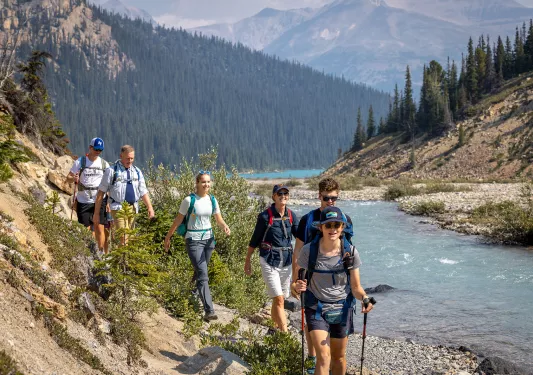 backroads guests hiking by a lake