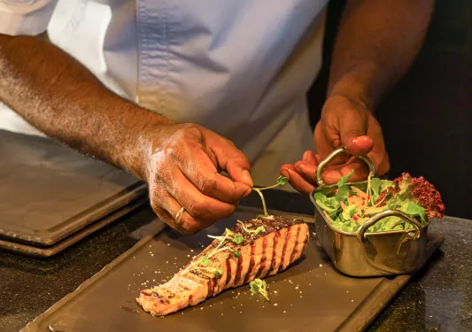 chef preparing salmon