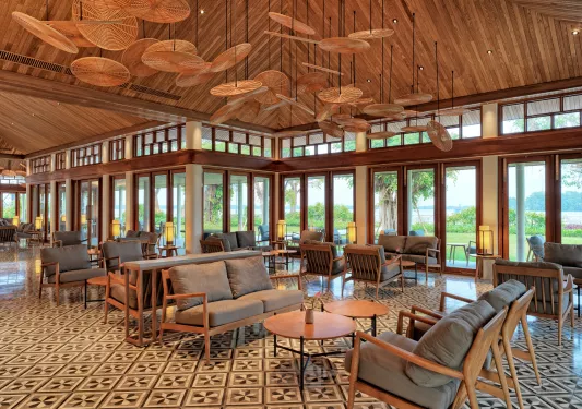 room with tiled floors and lounge furniture