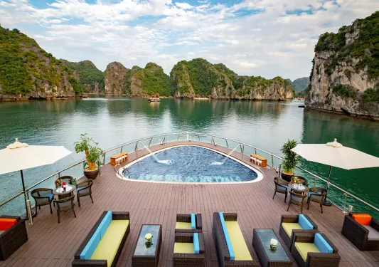 helm of boat with hot tub floating on river