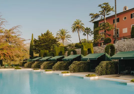 Outdoor pool with green canopies