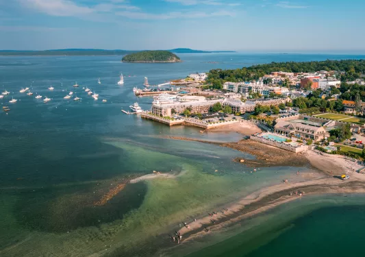 Seaside town with boats scattered in the ocean