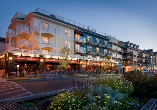 Hotel building with outdoor dining on the sidewalk