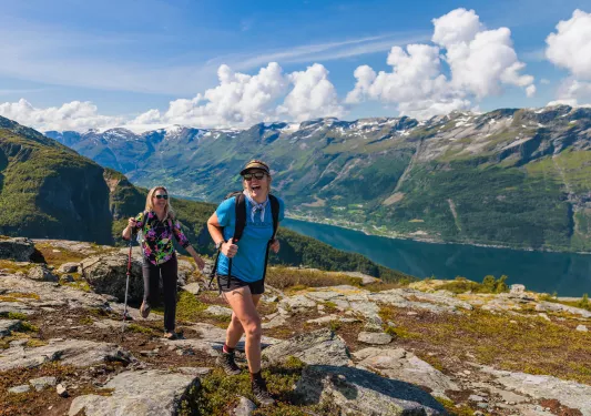 Two hikers at a summit