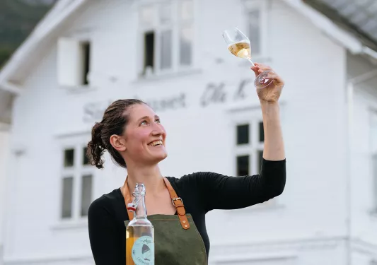 a leader examines a glass of wine