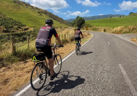 backroads guests biking down a road