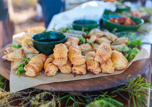 A platter of food on a picnic table