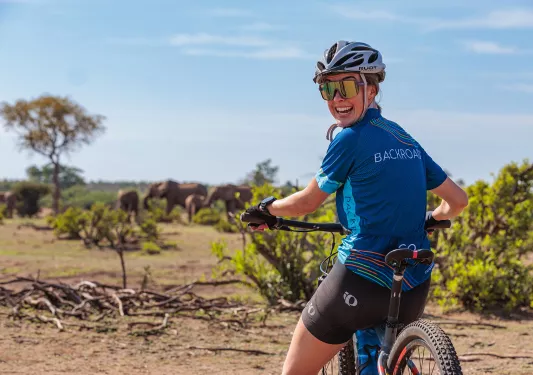 A biker turns to smile for the camera