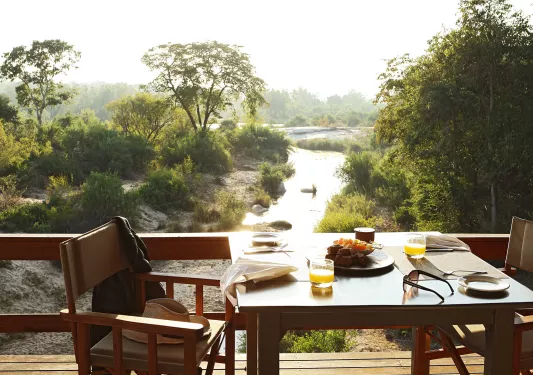 Table on a deck overlooking river