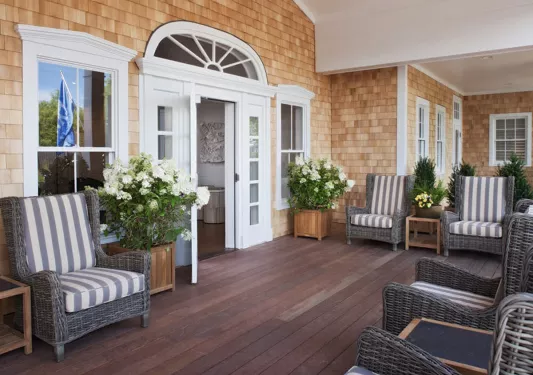 wooden deck with Adirondack chairs