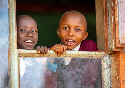 children looking out a window