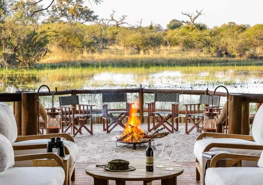 patio with firepit on a lake