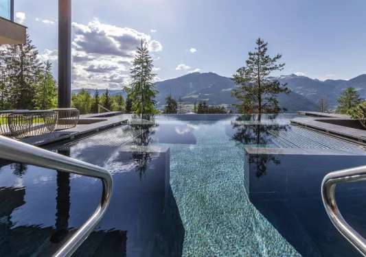 Outdoor infinity pool looking out towards the mountains